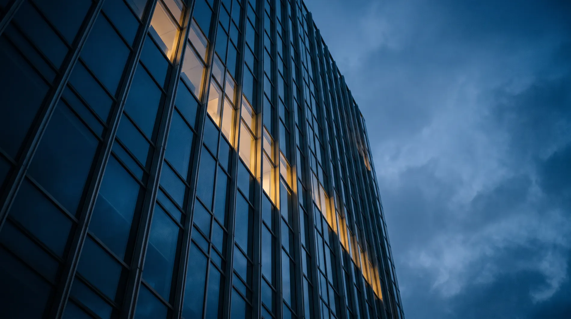 Glass office tower at blue hour